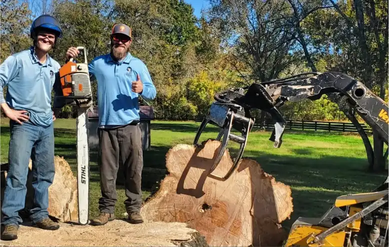 Owner and employee of TN Tree Preservation holding chainsaw